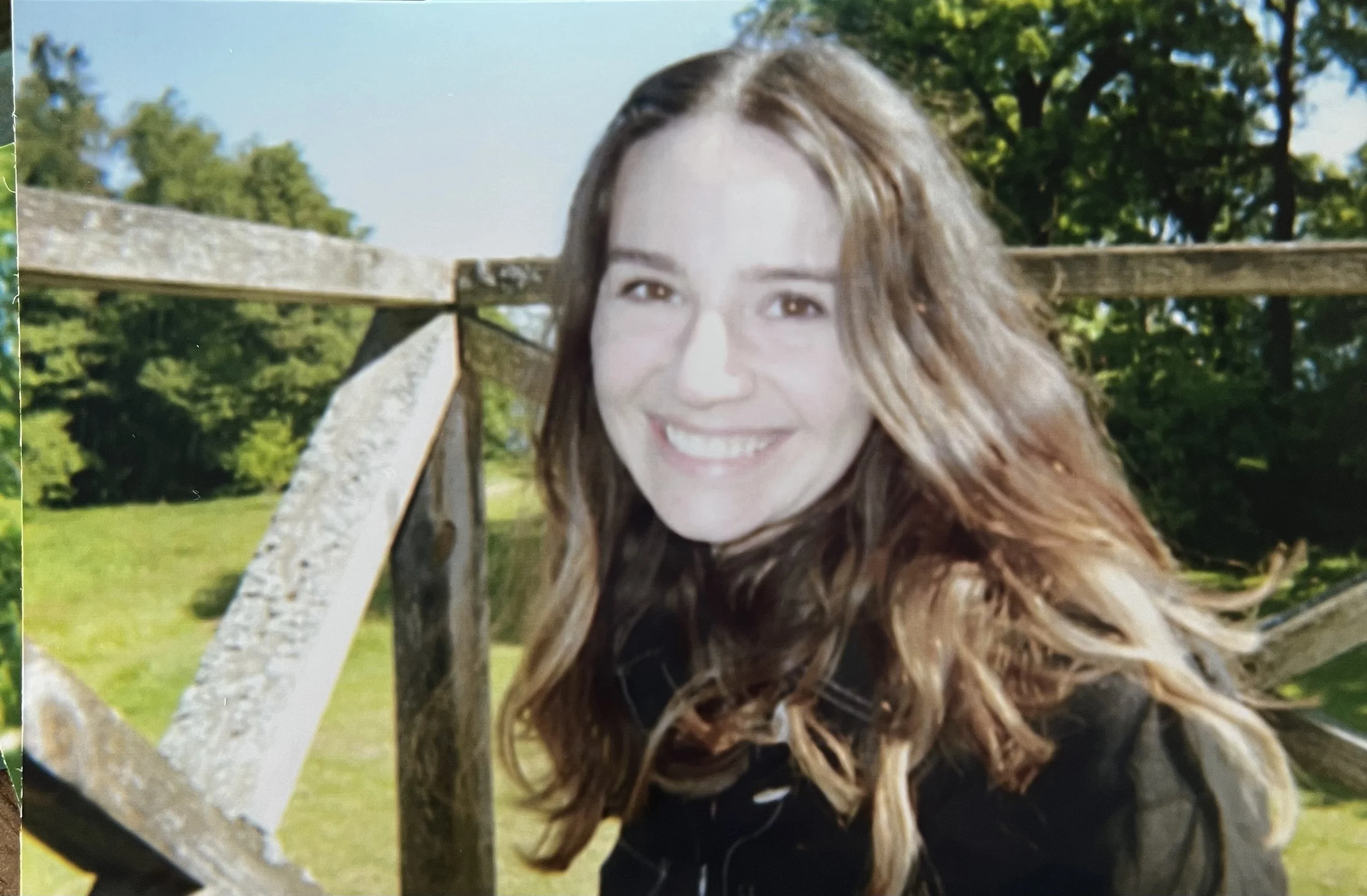 Portrait by wooden fence